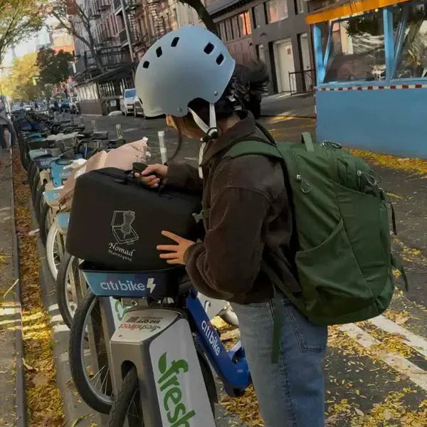 Nomad portable mannequin transported by bike, ready for quick setup at a craft fair or trade show